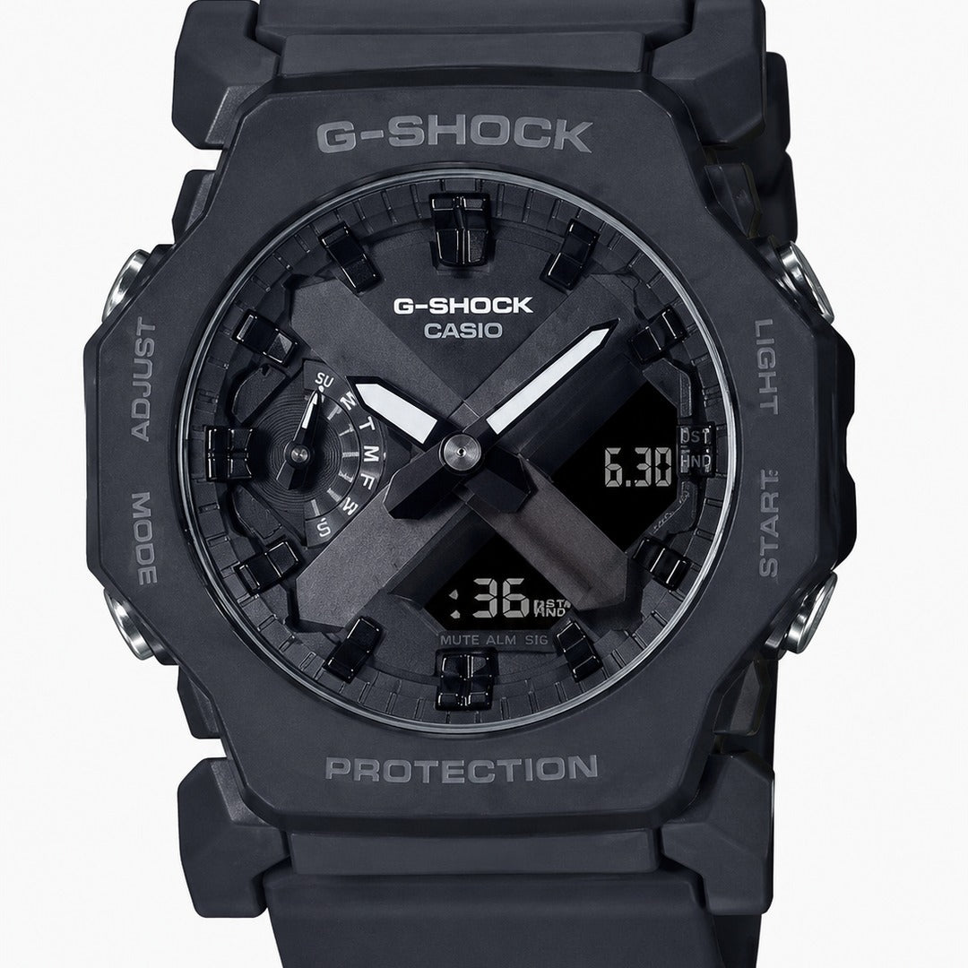 A black Casio G-Shock analog-digital watch with a rugged rectangular case, black resin strap, and a dark gray dial with white markings and hands.