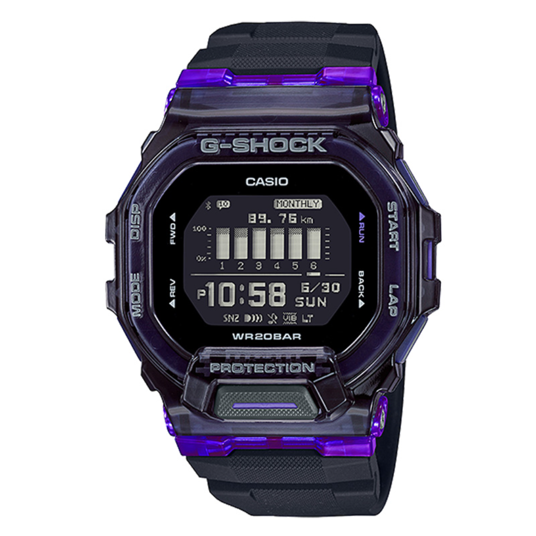 A Casio G-Shock digital watch with a translucent dark purple and black case and strap, featuring a black display screen showing the time and digital interface details.