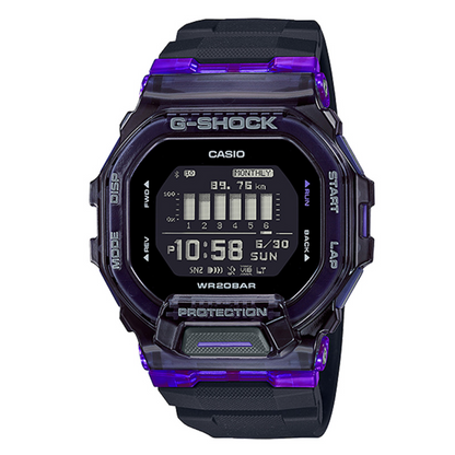 A Casio G-Shock digital watch with a translucent dark purple and black case and strap, featuring a black display screen showing the time and digital interface details.