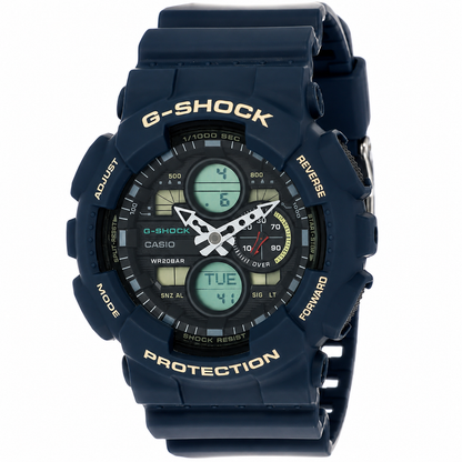 A Casio G-Shock analog-digital watch with a dark navy blue resin case and strap, featuring gold lettering and a black dial with green LCD displays.